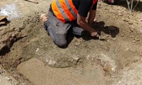 An archaeologist uncovers the indoor pool in the Roman villa, the first such find in the area. Source: Albania’s National Institute of Cultural Heritage / Facebook.