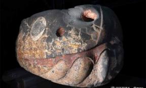 Colorful, stone snake deity head recovered in Mexico City.      Source: LANCIC. UNAM/INAH