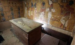 The stone sarcophagus containing the mummy of King Tut is seen in his underground tomb.