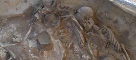 Collective burial pit excavated at Krasnoyarsk, Siberia. 	Source: Dimitry Vinogradov/Haaretz