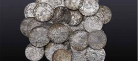 The Braintree hoard of 122 Anglo-Saxon pennies, found in Essex, England.      Source: Noonans