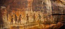 Rock art prehistoric aboriginal cave paintings of human silhouettes. Source: Jan/Adobe Stock