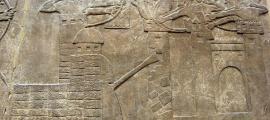 Assyrian attack on a town with archers and a wheeled battering ram, 865–860 BC. 