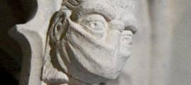 A figure wearing a face mask in St Albans Cathedral