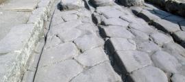 The passage of carts over decades could cause ruts (like the one shown), particularly in high-traffic areas of Pompeii.