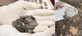 A handful of the medieval coin hoard found in Visingsö, Sweden	Source: Jönköping County Museum