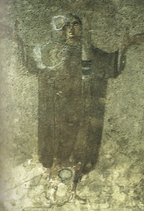 Image of ‘the veiled woman’ in the Santa Priscilla catacombs. 