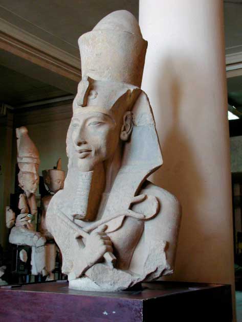 It’s tough to be the pharaoh! Akhenaten had supreme power, but was very controversial. A colossal statue of Akhenaten from his Aten Temple at Karnak, now on display at the Egyptian Museum of Cairo. (Gerard Ducher / CC BY SA 2.5)